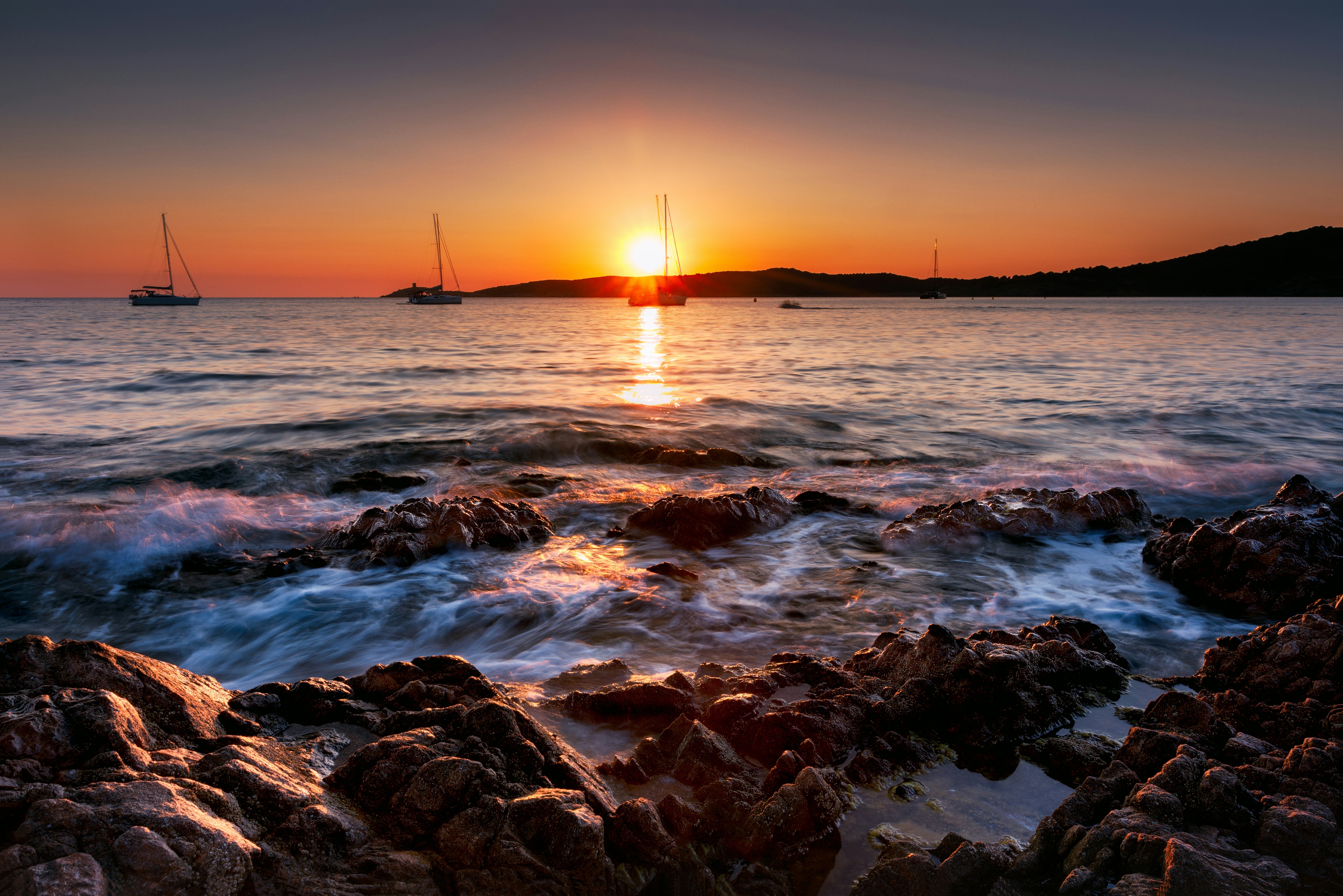 body of water during sunset